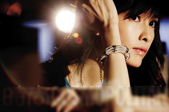 周慧敏婚后回顾 湿吻门 :那不是天大的事(图)-周